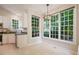 Breakfast nook with large windows and updated light fixture providing ample natural light at 125 Chimney Rise Dr, Cary, NC 27511