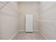 Walk-in closet with built-in shelving and a cabinet at 125 Chimney Rise Dr, Cary, NC 27511