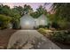 Well-maintained one-story home displaying light blue siding, landscaped yard, and an attached garage at 125 Chimney Rise Dr, Cary, NC 27511