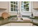Close up of the kitchen sink with garden window and stainless faucet at 125 Chimney Rise Dr, Cary, NC 27511