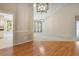 Spacious room showcasing hardwood floors with a gas fireplace at 125 Chimney Rise Dr, Cary, NC 27511