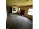 Inviting living room with a cozy fireplace and two windows to let in the natural light at 1305 E Jones St, Raleigh, NC 27610