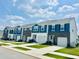New construction street view showcasing charming townhomes with attached garages at 133 N Chubb Rdg, Wilson's Mills, NC 27520