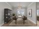 Dining room with stylish decor, a modern light fixture, and views of the outdoors at 1400 Gathering Park Cir # 203, Cary, NC 27519