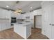 Modern kitchen featuring white cabinets, quartz countertops, stainless steel appliances, and wood floors at 1400 Gathering Park Cir # 203, Cary, NC 27519
