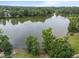 A scenic lake view surrounded by lush green trees offering a tranquil setting at 1400 Gathering Park Cir # 203, Cary, NC 27519