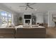 Spacious living room with large windows, a fireplace, and comfortable seating at 1400 Gathering Park Cir # 203, Cary, NC 27519