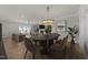 Open-concept view of living and dining room with modern décor, wood flooring, and natural light at 1400 Gathering Park Cir # 203, Cary, NC 27519