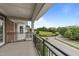 Balcony view overlooking green lawns and a neighborhood street at 1400 Gathering Park Cir # 301, Cary, NC 27519