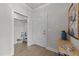 Hall closet entrance with shelf and bench seating plus overhead lighting at 1400 Gathering Park Cir # 301, Cary, NC 27519
