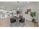 Open concept view of dining area with kitchen in the background at 1400 Gathering Park Cir # 301, Cary, NC 27519
