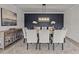 Elegant dining room with a long table, comfortable seating, and a stylish chandelier at 1400 Gathering Park Cir # 301, Cary, NC 27519