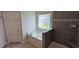 Bathroom with shower, soaking tub, mosaic tile, and a white vanity at 147 River Chapel Dr, Fuquay Varina, NC 27526