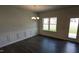 Formal dining area features a chandelier, wood flooring, and decorative wall trim at 147 River Chapel Dr, Fuquay Varina, NC 27526