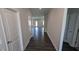 Inviting entryway with wood floors and white trim, leading to a bright living area at 147 River Chapel Dr, Fuquay Varina, NC 27526