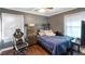 Bedroom with ceiling fan, hardwood floor, and natural light at 1508 Carroll Heights Rd, Zebulon, NC 27597