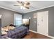 Bedroom with ceiling fan, hardwood floor, and natural light at 1508 Carroll Heights Rd, Zebulon, NC 27597