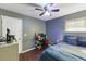 Bedroom with ceiling fan, hardwood floor, and natural light at 1508 Carroll Heights Rd, Zebulon, NC 27597