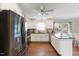 Modern kitchen with stainless steel appliances, granite countertops, white cabinets, and hardwood floors at 1508 Carroll Heights Rd, Zebulon, NC 27597
