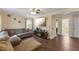 Spacious living room with hardwood floors, an entertainment center, and seamless flow to other rooms at 1508 Carroll Heights Rd, Zebulon, NC 27597