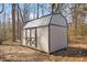 Exterior view of modern shed with a metal roof and wooden frame at 1508 Carroll Heights Rd, Zebulon, NC 27597