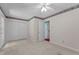 Bedroom with carpet, a ceiling fan, closet doors, an exterior door and floral wallpaper border at 18 Red Pine Rd, Chapel Hill, NC 27516