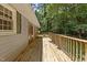 Long wooden deck with a nice view of the wooded area surrounding the house at 18 Red Pine Rd, Chapel Hill, NC 27516