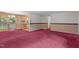 Traditional living room features vintage wallpaper, a glass door, and wall-to-wall maroon carpeting at 18 Red Pine Rd, Chapel Hill, NC 27516