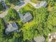 The aerial view highlights the location of the property within a quiet, tree-lined neighborhood at 208 Holly Green Ln, Holly Springs, NC 27540