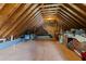 Spacious unfinished attic with wood trusses, possible storage, and some duct work at 208 Holly Green Ln, Holly Springs, NC 27540