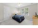 Bedroom with a bright window view, and carpet flooring at 208 Holly Green Ln, Holly Springs, NC 27540