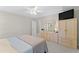A comfortably furnished bedroom with a light color scheme and ample closet space at 208 Holly Green Ln, Holly Springs, NC 27540