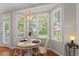 Eat-in kitchen with a charming breakfast nook that features a pendant light and backyard views at 208 Holly Green Ln, Holly Springs, NC 27540