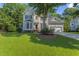 Charming two-story home with manicured lawn and attached two-car garage at 208 Holly Green Ln, Holly Springs, NC 27540