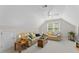 Large living room offers vaulted ceilings, a ceiling fan, and comfortable seating at 208 Holly Green Ln, Holly Springs, NC 27540