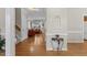 Spacious living room with hardwood floors and a view of the entry foyer at 208 Holly Green Ln, Holly Springs, NC 27540