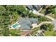 Sprawling property showcasing an amazing in-ground pool, lush landscaping, and large driveway at 2112 Colin Hill Ct, Wake Forest, NC 27587