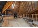 Unfinished attic space with exposed beams, offering potential for customization and additional storage at 2112 Colin Hill Ct, Wake Forest, NC 27587