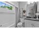 Clean, bright bathroom with tiled shower and tub combination with modern sink and vanity at 2112 Colin Hill Ct, Wake Forest, NC 27587