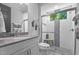 Modern bathroom featuring a glass-enclosed shower with a bench and tiled accent wall at 2112 Colin Hill Ct, Wake Forest, NC 27587