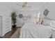Bedroom features decorative wall art, hardwood floors, and a decorative potted tree at 2112 Colin Hill Ct, Wake Forest, NC 27587