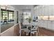 Eat-in kitchen with white table, chairs, and decorative cabinets at 2112 Colin Hill Ct, Wake Forest, NC 27587