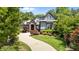 Beautiful home with a winding driveway, lush landscaping, and a manicured lawn at 2112 Colin Hill Ct, Wake Forest, NC 27587
