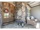 Inviting front porch featuring stone accents, seating, and decorative wreaths on the front door at 2112 Colin Hill Ct, Wake Forest, NC 27587