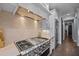 Gourmet kitchen with stainless appliances and designer backsplash at 2112 Colin Hill Ct, Wake Forest, NC 27587