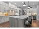 Spacious kitchen features an oversized island, stainless appliances, and stylish pendant lighting at 2112 Colin Hill Ct, Wake Forest, NC 27587