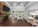 Spacious living room with a fireplace, built-ins, and large windows overlooking the backyard at 2112 Colin Hill Ct, Wake Forest, NC 27587