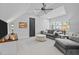 Comfortable living room featuring a gray sofa set and a ceiling fan at 2112 Colin Hill Ct, Wake Forest, NC 27587