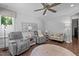 Relaxing living room with neutral walls, ceiling fan and hardwood flooring at 2112 Colin Hill Ct, Wake Forest, NC 27587