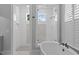 This stylish bathroom offers a soaking tub, a separate shower, and a sink at 2112 Colin Hill Ct, Wake Forest, NC 27587